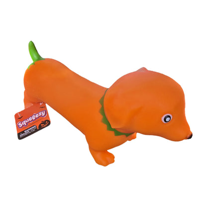 Orange pumpkin weenie dog dachshund squishy with green stem tail and leafy collar, side view with Squeeezy hang tag