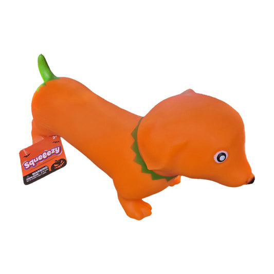 Orange pumpkin weenie dog dachshund squishy with green stem tail and leafy collar, side view with Squeeezy hang tag