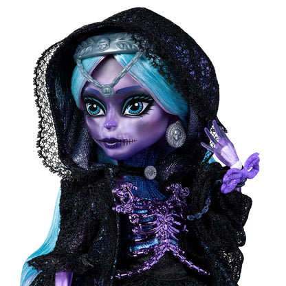Vampire-themed doll with blue hair and purple accents on a white background